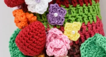 Guirlanda de flores em amigurumi
