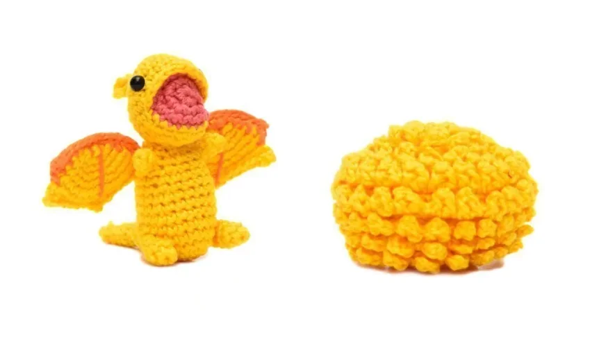 Ovo com filhote de Dragão amarelo em amigurumi