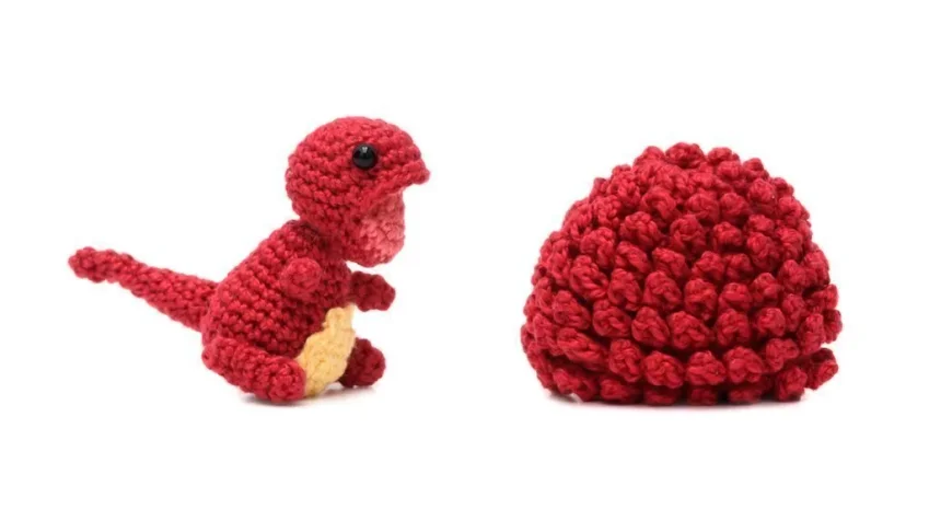 Ovo com filhote de dinossauro vermelho em amigurumi