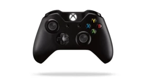 Console Xbox One com controle e jogo Assassin's Creed Unity