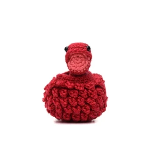 Ovo com filhote de dinossauro vermelho em amigurumi - Artesanato e Personalizados
