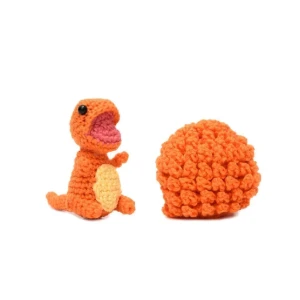 Ovo com filhote de dinossauro laranja em amigurumi - Artesanato e Personalizados