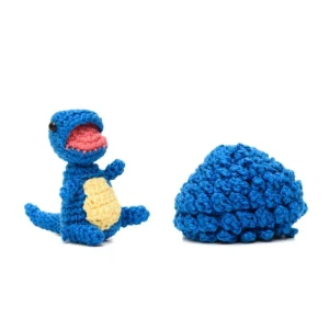 Ovo com filhote de dinossauro azul em amigurumi - Artesanato e Personalizados